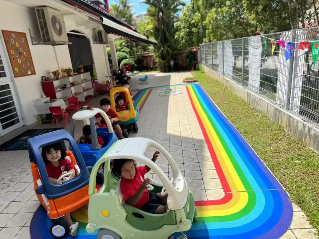 Children engaged in outdoor play at the Jurong West childcare centre playground