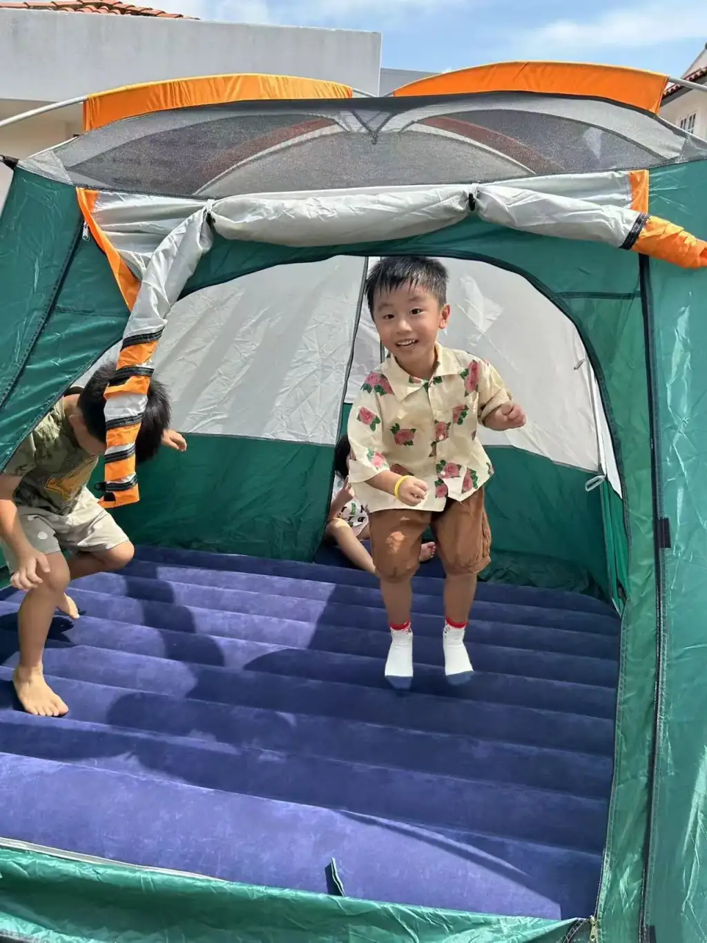 Outdoor playground with climbing structure at MapleBear Jurong West childcare centre