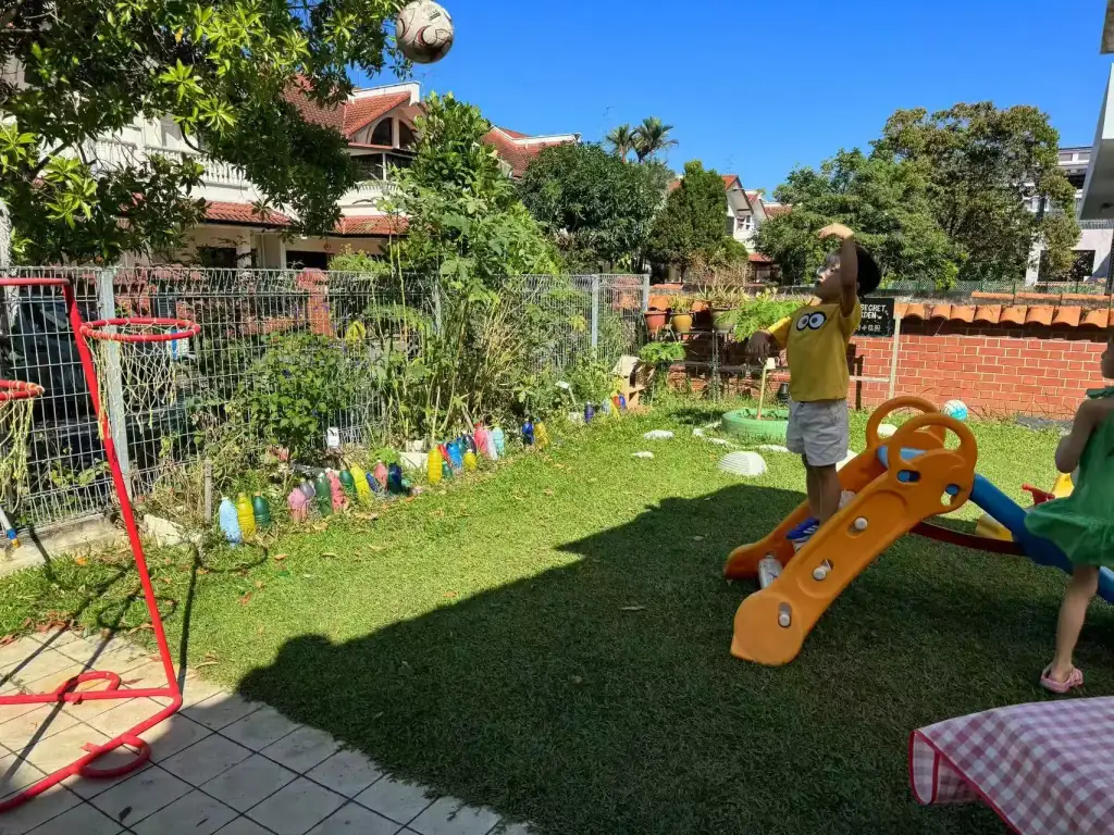 Children enjoying the outdoor playground at MapleBear Jurong West preschool near NTU