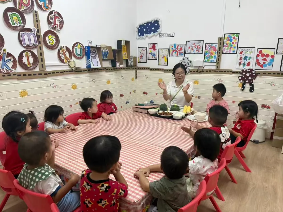 Children engaged in group learning activity at MapleBear Jurong West bilingual preschool